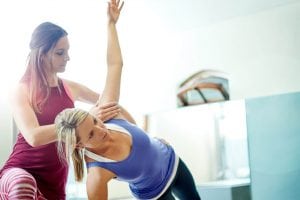 Personal trainer coaches a member.